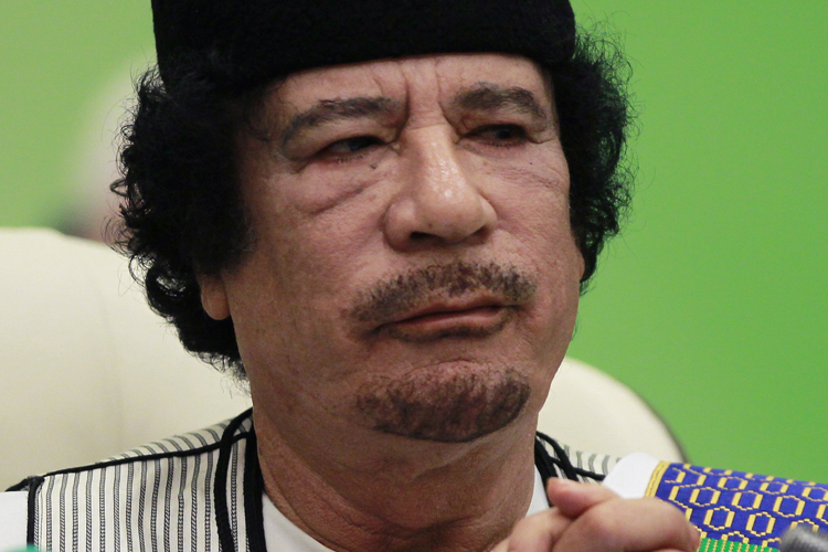 Libya's leader Muammar Gaddafi delivers a speech at the start of the third European Union-Africa summit in Tripoli November 29, 2010. Gaddafi warned the European Union on Monday that Africa would turn to other trade partners if the EU kept trying to dictate to the continent how it should develop.  REUTERS/Francois Lenoir   (LIBYA - Tags: POLITICS BUSINESS HEADSHOT) (Â© Francois Lenoir / Reuters)