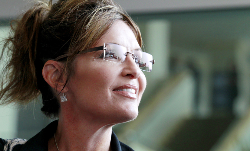 Former Alaska Gov. Sarah Palin exits the Hyatt Regency Hotel, Wednesday, June 1, 2011 in Jersey City, N.J. (AP Photo/Julio Cortez) (Julio Cortez)