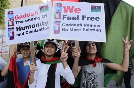 Libyan chant slogans against Moammar Gadhafi during a demonstration in the rebel-held capital Benghazi, Libya, Saturday, June 25, 2011. (AP Photo/Hassan Ammar) (AP)