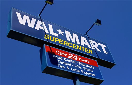 The WalMart Supercenter signage is seen in Springfield, Ill., Monday, May 16, 2011. Wal-Mart Stores Inc. is reporting Tuesday, May 17, a 3 percent increase in first-quarter net income, beating Wall Street expectations because of robust international business and cost controls.  (AP Photo/Seth Perlman) (AP)