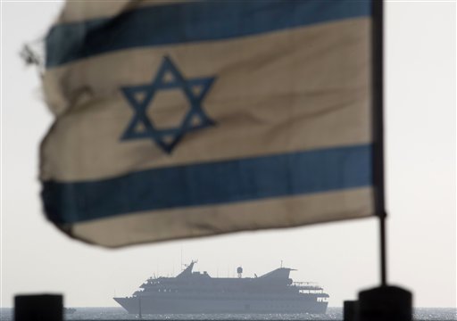 FILE - In this May 31, 2010 file photo the Mavi Marmara ship, the lead boat of a flotilla headed to the Gaza Strip which was stormed by Israeli naval commandos in a predawn confrontation, sails into the port of Ashdod, Israel. Israel on Sunday, June 26, 2011, threatened to ban international journalists for up to a decade from the country if they join a flotilla planning to breach the Israeli blockade of the Gaza Strip. (AP Photo/Ariel Schalit, File) (AP)