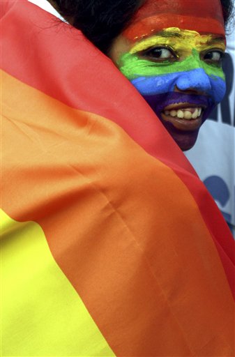 FILE - In this July 2, 2009 file photo, a gay rights activist in Calcutta, India, participates in a rally celebrating the groundbreaking ruling by the Delhi High Court decriminalizing homosexuality. The United Nations issued its first condemnation of discrimination against gays, lesbians and transgender people on Friday, June 17, 2011, in a cautiously worded declaration hailed by supporters as a historic moment. Members of the U.N. Human Rights Council narrowly voted in favor of the resolution put forward by South Africa, against strong opposition from African and Islamic countries. (AP Photo/Sucheta Das, File) (AP)
