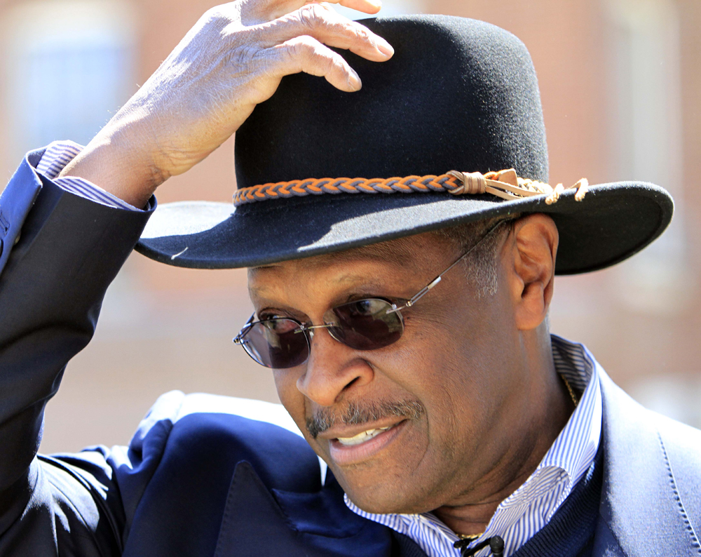 Possible 2012 Republican presidential hopeful Herman Cain gets ready to speak at a Tea Party rally at the Statehouse, Friday, April 15, 2011, in Concord, N.H. (AP Photo/Jim Cole) (Jim Cole)