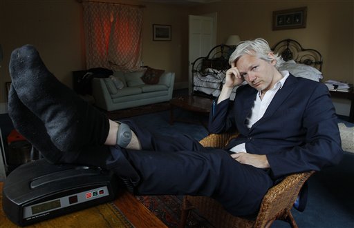 WikiLeaks founder Julian Assange is seen with his ankle security tag at the house where he is required to stay, near Bungay, England, Wednesday, June 15, 2011.  Assange says his house arrest over sex allegations is hampering the work of the secret-spilling site, and his supporters accuse Britain of spying on him.  The 39-year-old Australian has spent six months at a supporter's rural estate as he fights extradition to Sweden, where he is accused of the rape and sexual assault of two women.(AP Photo/Kirsty Wigglesworth) (AP)