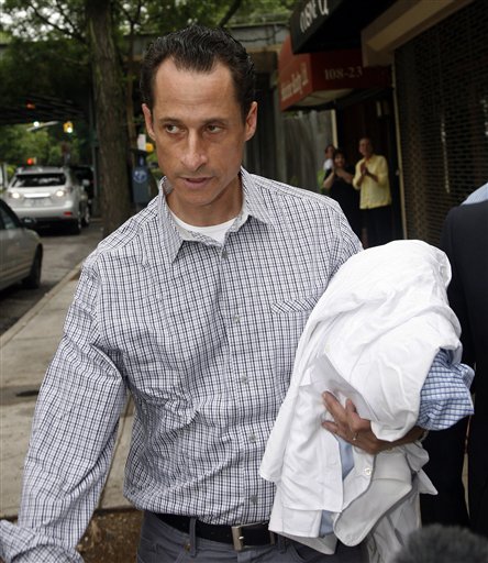 FILE - In this June 11, 2011 file photo, Rep. Anthony Weiner, D-N.Y., carries his laundry to a laundromat near his home in the Queens borough of New York, Saturday, June  11, 2011. Weiner admitted last week that he had Tweeted sexually charged messages and photos to at least six women and lied about it.  (AP Photo/David Karp, File) (AP)