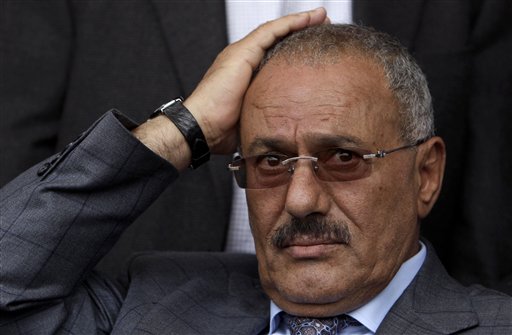 FILE - In this April 8, 2011 file photo, Yemeni President Ali Abdullah Saleh reacts while looking at his supporters, not pictured, during a rally supporting him, in Sanaa,Yemen. A government official says Yemen's president was lightly injured and four top officials wounded when opposition tribesmen struck his palace with rockets, Friday, June 3, 2011. (AP Photo/Muhammed Muheisen, File) (AP)