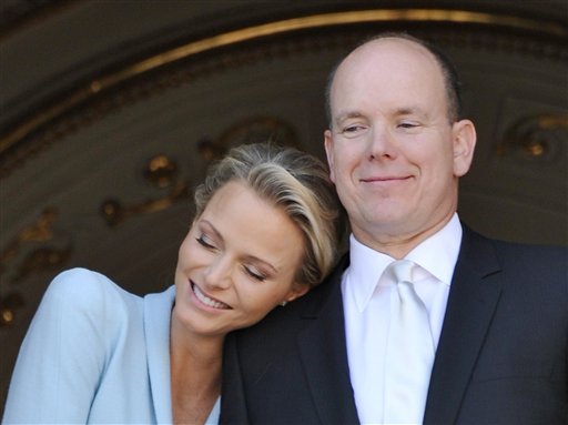Prince Albert II of Monaco appears with his bride Charlene Princess of Monaco at the Monaco palace, after the civil wedding marriage ceremony, Friday, July 1, 2011. (AP Photo/Bruno Berbert, Pool) (AP)