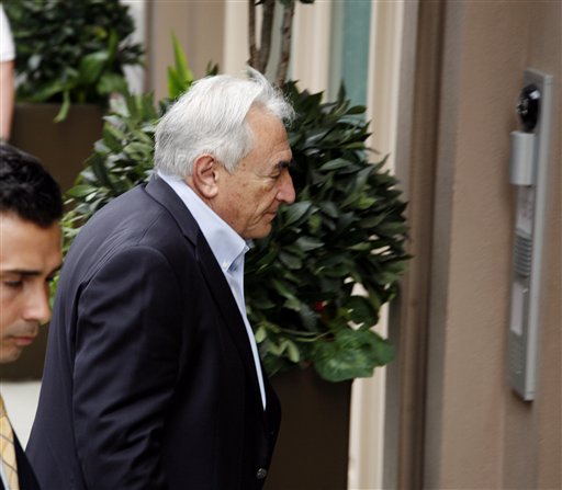 Former International Monetary Fund chief Dominique Strauss-Kahn returns to his house on Franklin St. in the Tribeca section of downtown Manhattan Saturday, July  2, 2011 in New York.  Strauss-Kahn was been accused by a Sofitel hotel maid of trying to rape her in May, but prosecutors told a judge on Friday, July 1, 2011,  they had discovered serious problems with the maid's credibility. The judge subsequently lifted his house arrest, allowing him to travel in the U.S. but not abroad. (AP Photo/David Karp) (AP)