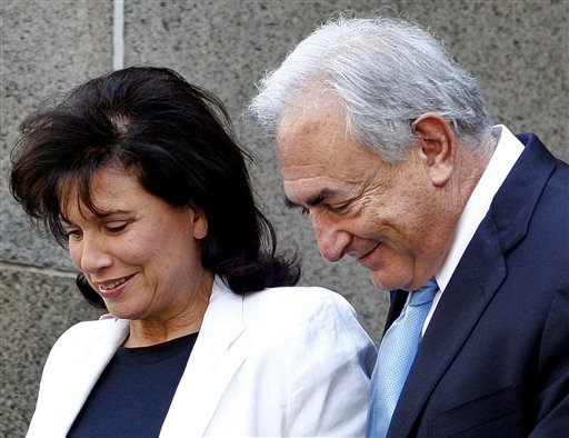 Former International Monetary Fund leader Dominique Strauss-Kahn leaves New York State Supreme court with his wife Anne Sinclair, Friday, July 1, 2011, in New York. A judge has agreed to free Strauss-Kahn without bail or home confinement in the sexual assault case against him. The criminal case against him stands. (AP Photo/David Karp) (AP)