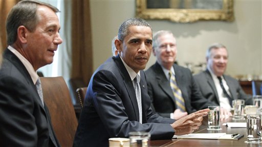 President Barack Obama sits with House Speaker John Boehner of Ohio, and Senate Minority Leader Mitch McConnell of Kentucky, and Sen. Dick Durbin, D-Ill., as he meets with Republican and Democratic leaders regarding the debt ceiling in the Cabinet Room of the White House in Washington, Wednesday, July 13, 2011. (AP Photo/Charles Dharapak) (AP)