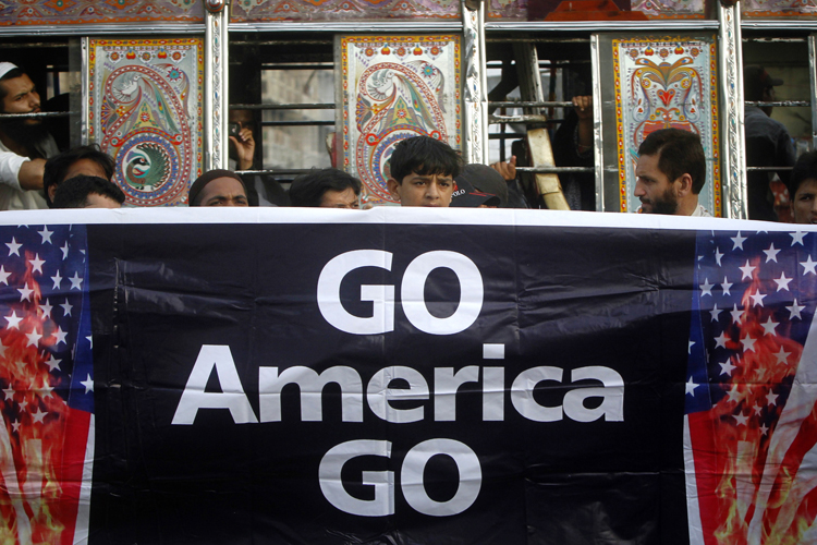 Supporters of Jamaat-e-Islami hold a banner during an anti-American rally through the streets of Karachi May 6, 2011