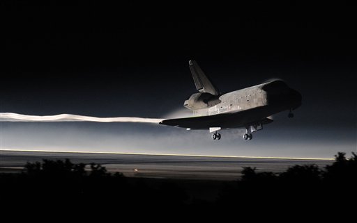 Space Shuttle Atlantis lands at the Kennedy Space Center at Cape Canaveral, Fla. Thursday, July 21, 2011. The landing of Atlantis marks the end of NASA's  30 year space shuttle program.  (AP Photo/Don Emmert, Pool) (AP)