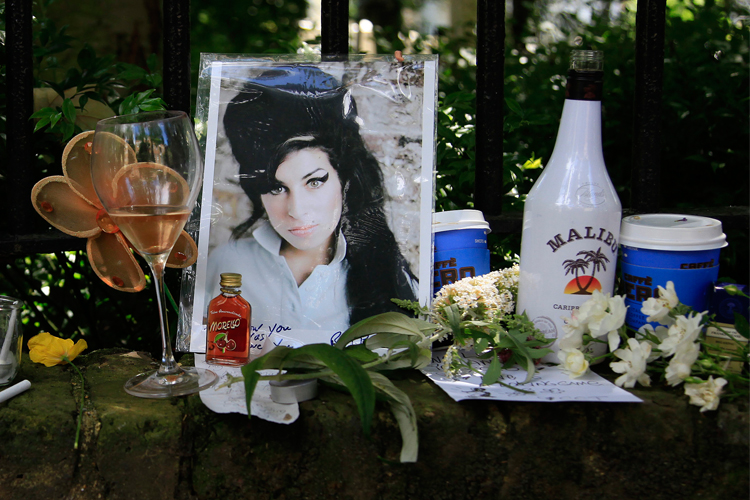 Flowers and tributes are seen outside the home of Amy Winehouse in London.