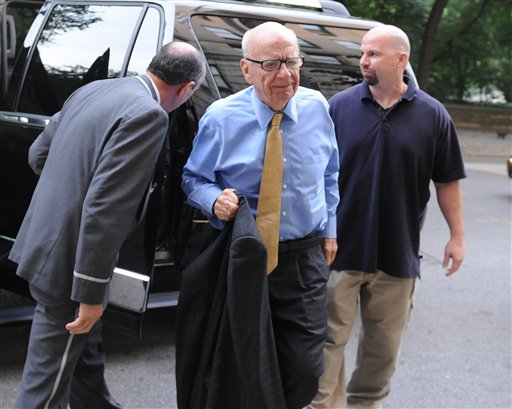 News Corporation head Rupert Murdoch arrives at his Fifth Avenue residence, Wednesday, July 20, 2011, in New York. Emerging relatively unscathed from a British parliamentary hearing on the phone hacking scandal, Rupert Murdoch returned to the United States on Wednesday, where his company faces a host of financial and legal challenges. (AP Photo/Louis Lanzano) (AP)