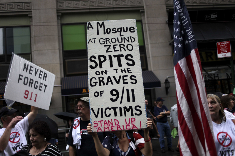 People participate in a rally against a proposed mosque and community center near ground zero in New York, Sunday, Aug. 22, 2010