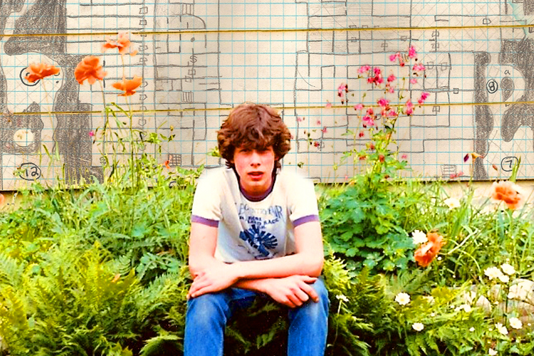 A photo of the author as a teen, with one of his D&D dungeon maps superimposed behind him.