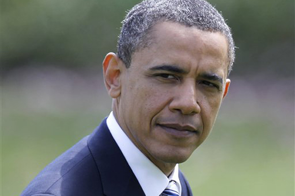 President Barack Obama returns to the White House in Washington, Friday, April 15, 2011, after a trip to Chicago. (AP Photo/Charles Dharapak) (Charles Dharapak)