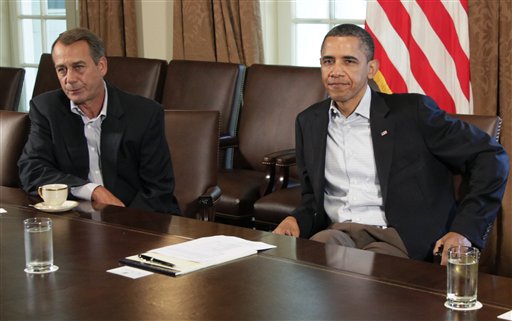 President Barack Obama sits next to House Speaker John Boehner of Ohio, left, in the Cabinet Room of the White House, Saturday, July 23, 2011, in Washington, as they meet to discuss the debt. (AP Photo/Carolyn Kaster) (AP)