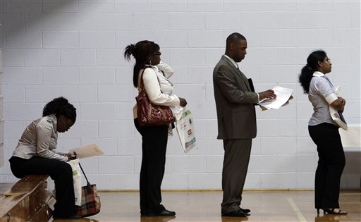 In this June 15, 2011 photo, job seekers wait in a line at a job fair in Southfield, Mich. Two years after economists declared the end of the Great Recession, the rebound is the weakest since the 1930s and the most lop-sided.  (AP Photo/Paul Sancya) (AP)