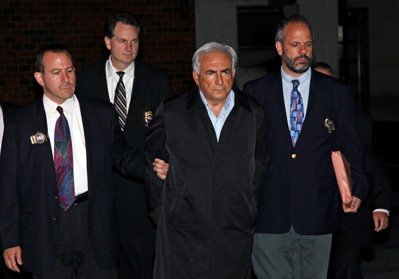 FILE - In this May 15, 2011 file photo, Dominique Strauss-Kahn, head of the International Monetary Fund, is lead from a police station in New York where he was being held. While American authorities have condoned, or at least tolerated, such âperp walksâ for more than a century, in France itâs been illegal to show images of suspects in handcuffs since 2000. French politicians and citizens alike are upset by the images, which they say make Strauss-Kahn, accused of sexual abuse, appear guilty. (AP Photo/Craig Ruttle, File) (Craig Ruttle)