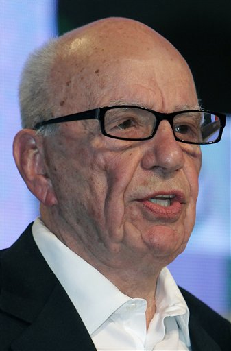 FILE - In this May 24, 2011 file photo, media magnate Rupert Murdoch speaks during the e-G8 conference, gathering Internet and information technologies leaders and experts, in Paris. Britain's prime minister demanded inquiries into a burgeoning phone hacking scandal as allegations mounted Wednesday, July 6, 2011, that a tabloid eavesdropped on missing schoolgirls and the families of terrorist bombing victims as well as celebrities and royals. The scandal poses a threat to Murdoch's global media empire, and is causing a growing number of companies to pull their ads from the News of the World tabloid in disgust. In addition, calls are mounting for Rebekah Brooks, Murdoch's top executive in Britain, to step down. (AP Photo/Bob Edme, File) (AP)