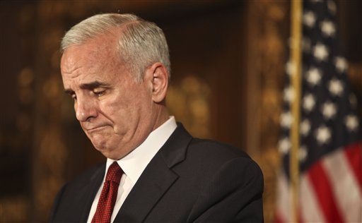 Gov. Mark Dayton addressed the media and some Republicans that were present as he said that the two sides were still not closeat the state capitol an hour left until a government shutdown. Minnesota state government shut down at 12:01 a.m. CDT Friday July 1, 2011 for the second time in six years after political leaders couldn't agree on how to solve a $5 billion budget deficit. (AP Photo Kyndell Harkness - STAR TRIBUNE) MANDATORY CREDIT (AP)