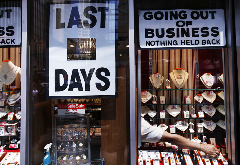 A man arranges jewelry at a store going out of business in New York June 8, 2011.    REUTERS/Shannon Stapleton   (UNITED STATES - Tags: BUSINESS SOCIETY) (Â© Shannon Stapleton / Reuters)