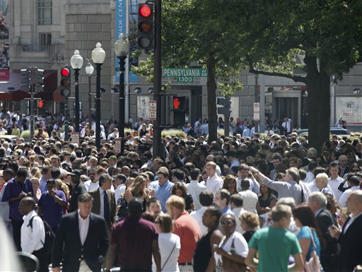 People crowd Pennsylvania Avenue in Washington, Tuesday, Aug. 23, 2011, as they evacuate buildings after an earthquake his the in Washington area. The 5.9 magnitude earthquake centered northwest of Richmond, Va., shook much of Washington, D.C., and was felt as far north as Rhode Island and New York City. (AP Photo/Charles Dharapak) (AP)