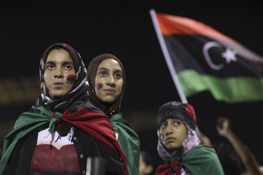 People demonstrate against Moammar Gadhafi at the Green Square in Tripoli, Libya, late Tuesday, Aug. 30, 2011. Libyan rebels say they're closing in on Gadhafi and issued an ultimatum Tuesday to regime loyalists in the fugitive dictator's hometown of Sirte, his main remaining bastion: surrender this weekend or face an attack. (AP Photo/Alexandre Meneghini) (AP)