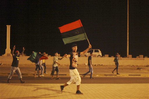 Libyans celebrate the capture of Moammar Gadhafi's son and one-time heir apparent, Seif al-Islam, on Monday, Aug. 22, 2011