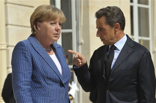 France's President Nicolas Sarkozy, right, points his finger as he speaks with  German Chancellor Angela Merkel as he welcomed the German leader at the Elysee Palace, in Paris Tuesday Aug. 16, 2011. (AP Photo/Philippe Wojazer, Pool) (AP)