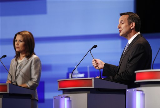Republican presidential candidate former Minnesota Governor Tim Pawlenty, right, speaks as Rep. Michele Bachmann, R-Minn. listens during the Iowa GOP/Fox News Debate at the CY Stephens Auditorium in Ames, Iowa, Thursday, Aug. 11, 2011. (AP Photo/Charlie Neibergall, Pool) (AP)