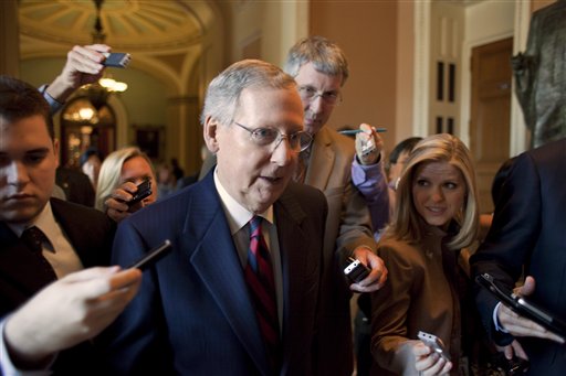 Senate Minority Leader Mitch McConnell, R-Ky., returns to his office following a vote as the debt crisis continues on Capitol Hill in Washington Sunday, July 31, 2011. (AP Photo/Harry Hamburg) (AP)