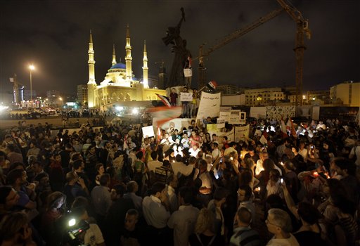 Lebanese intellectuals and journalists protest during a vigil sit-in to show their support to the Syrian protesters who demonstrate against the Syrian President Bashar Assad, at the Martyrs square, in downtown of Beirut, Lebanon, on Monday Aug. 8, 2011. Despite five months of blistering attacks on dissent, the Syrian regime has yet to score a decisive victory against a pro-democracy uprising determined to bring down the country's brutal dictatorship. President Bashar Assad still has the military muscle to level pockets of resistance, but the conflict has robbed him of almost all international support. (AP Photo/Hussein Malla) (AP)