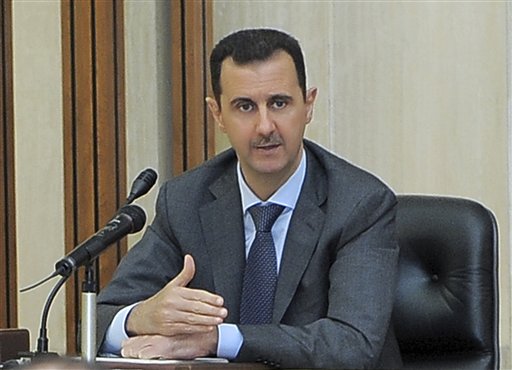 FILE - In this Aug. 17, 2011 file photo released by the Syrian official news agency SANA, Syrian President Bashar Assad addresses a meeting of the central committee of the Baath party in Damascus, Syria. Despite Assad's assurances to U.N. Secretary-General Ban Ki-moon that military and police operations had stopped, Syrian security forces fired at thousands of protesters who poured into the streets throughout the country Friday, Aug. 19, killing at least 13, activists said. (AP Photo/SANA, File) EDITORIAL USE ONLY (AP)