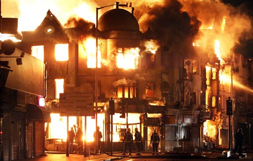 A property is on fire near Reeves Corner in Croydon, south London Tuesday, Aug. 9, 2011. A wave of violence and looting raged across London and spread to three other major British cities on Tuesday, as authorities struggled to contain the country's worst unrest since race riots set the capital ablaze in the 1980s. (AP Photo/PA, Lewis Whyld) UNITED KINGDOM OUT, NO SALES, NO ARCHIVE (AP)