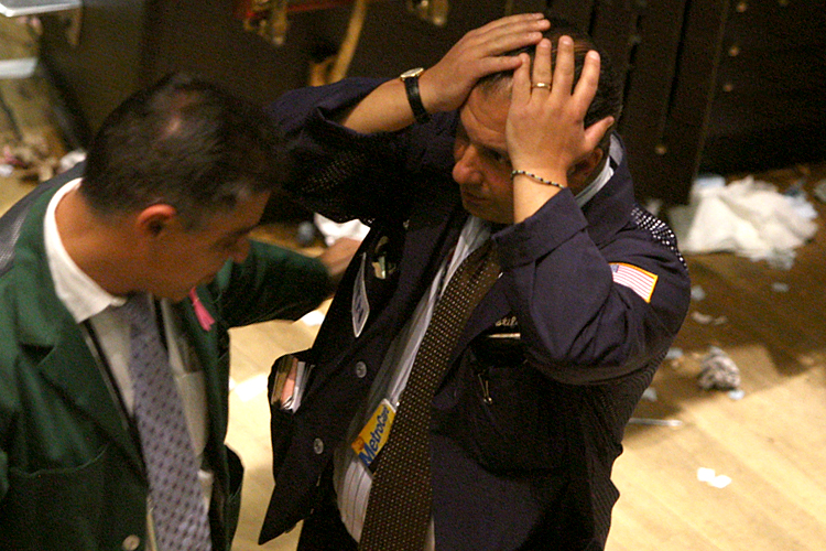 Traders work on the floor of the New York Stock Exchange, October 15, 2008.