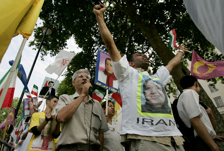 Supporters of the National Council of Resistance of Iran, the political arm of the Mujahedeen Khalq, take part in a protest near Downing Street in London