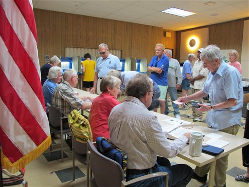 Residents in Glendale, Wis., which is also also Sen. Alberta Darlings district, line up Tuesday, July 12, 2011, to vote in a Democratic primary election ahead of a recall election next month. Darling is one of six Republican state senators being targeted for recall for supporting Republican Gov. Scott Walkers budget-repair bill. Three Democratic state senators are also being targeted for recall for fleeing the state to stall action on the bill.  (AP Photo/Dinesh Ramde) (AP)