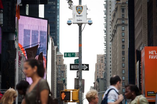 Pedestrians start their morning under the watchful eyes of surveillance cameras in Times Square in New York, Tuesday, Aug. 19, 2011. Since the terrorist attacks of Sept. 11, 2001, the New York Police Department has become one of the country's most aggressive domestic intelligence agencies, one that operates far outside its borders and targets ethnic communities in ways that would run afoul of civil liberties rules if practiced by the federal government. (AP Photo/John Minchillo) (AP)