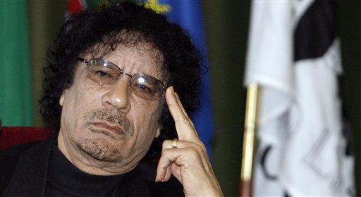 FILE -- In a Dec. 7, 2007 file photo Libyan leader Moammar Gadhafi gestures while speaking during media conference at the University of Lisbon, in Lisbon,  Libyan rebels took control of most of Tripoli in a lightning advance Sunday, Aug. 21, 2011, but the leader's whereabouts were unknown and pockets of resistance remained.  (AP Photo/Paulo Duarte/file) (AP)