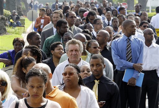 Crowds of job-seekers wait to enter a job fair at Crenshaw Christian Center in South Los Angeles, Wednesday, Aug. 31, 2011. Fewer people applied for unemployment benefits last week, a sign layoffs have stabilized. (AP Photo/Reed Saxon) (AP)