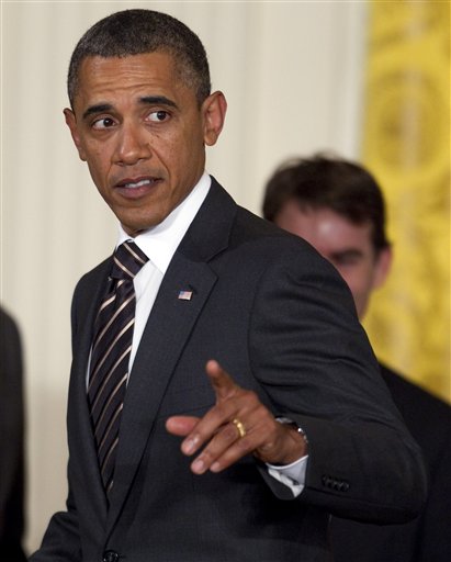 President Barack Obama gestures during an event in the East Room of the White House to honor NASCAR driver Jimmie Johnson for his fifth consecutive championship on Wednesday, Sept. 7, 2011, in Washington.  (AP Photo/Evan Vucci) (AP)