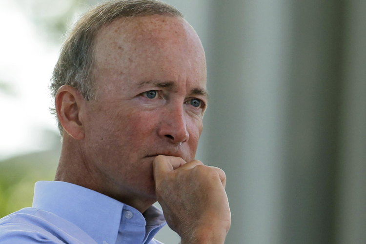 Indiana Gov. Mitch Daniels listens as state first lady Cheri Daniels speaks during a memorial service at the Indiana State Fair in Indianapolis, Monday, Aug. 15, 2011. The service was held for those killed in a weekend stage collapse at the fair. (AP Photo/Darron Cummings) (Darron Cummings)