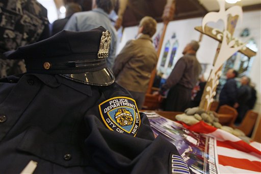 A uniform from the NYPD is displayed  during a special service to commemorate the 10th anniversary of the Sept. 11 terrorist attacks, at a church in New Plymouth, New Zealand, Sunday, Sept. 11, 2011. The US team will play Ireland in their opening Rugby World Cup game later today.  (AP Photo/Dita Alangkara) (AP)