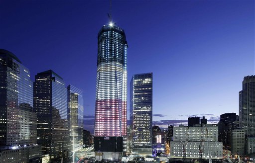One World Trade Center overlooks the ground zero memorial site, Saturday, Sept. 10, 2011, in New York. Ceremonies will be held at the site Sunday for the 10th anniversary of the September 11 attacks. (AP Photo/Mark Lennihan) (AP)
