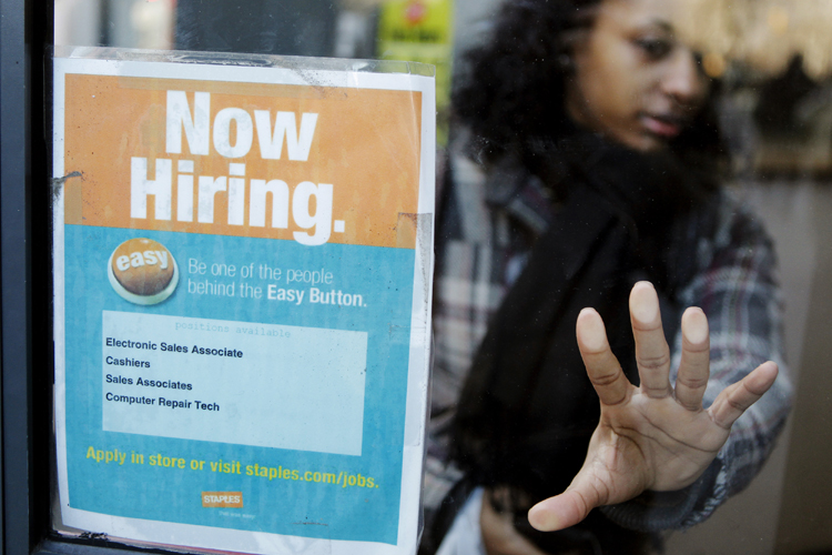 A woman opens a glass door with a "Now Hiring" sign on it as she enters a Staples store in New York March 3, 2011.  New U.S. claims for 
unemployment benefits fell last week to their lowest level in 
more than 2-1/2 years, signalling an acceleration in job 
creation could be taking shape. 
 
 REUTERS/Lucas Jackson (UNITED STATES - Tags: EMPLOYMENT BUSINESS) (Reuters)