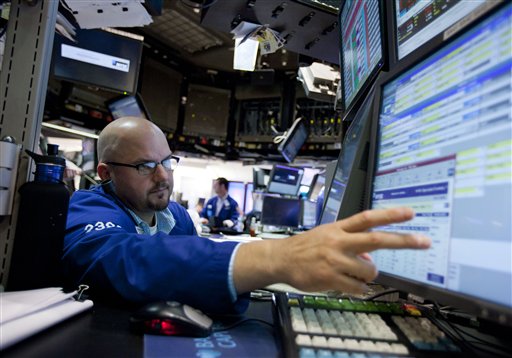 In this Aug. 26, 2011 photo, a trader works on the floor of the New York Stock Exchange, in New York. World stock markets rose on Monday, Aug. 29, 2011, heartened by Federal Reserve chief Ben Bernanke's call on the U.S. government to help the economy and his refusal to rule out more monetary stimulus by the central bank. (AP Photo/Jin Lee) (AP)