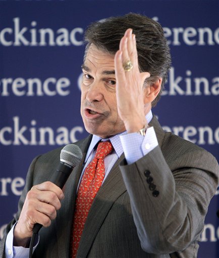 Republican presidential candidate Texas Gov. Rick Perry addresses the Republican Leadership Conference at the Grand Hotel on Mackinac Island, Mich., Saturday, Sept. 24, 2011. (AP Photo/Carlos Osorio) (AP)