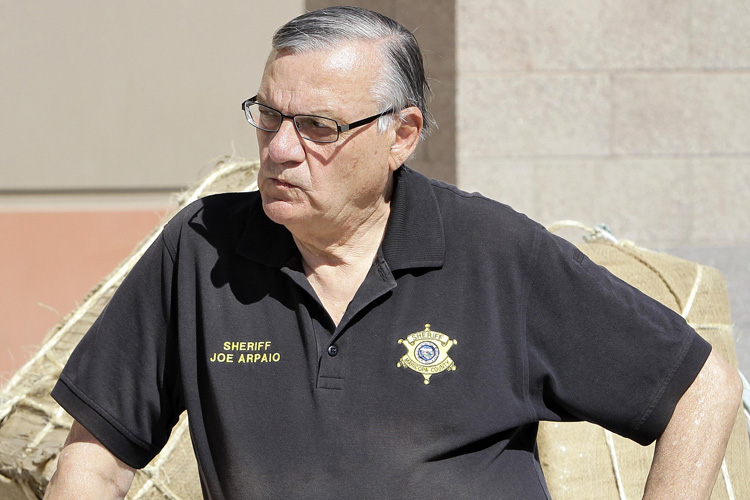 Maricopa County Sheriff Joe Arpaio, showcasing 2,300 lbs of seized marijuana, waits to address the media Thursday, May 12 2011 outside the Sheriff's training center in Phoenix. Sheriff Arpaio confirms two agents were killed in a freight train collision. And he says the FBI will be taking over the investigation. (AP Photo/Matt York) (Matt York)